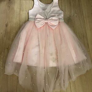 Elegant Pink Dress with Bow and Pearls